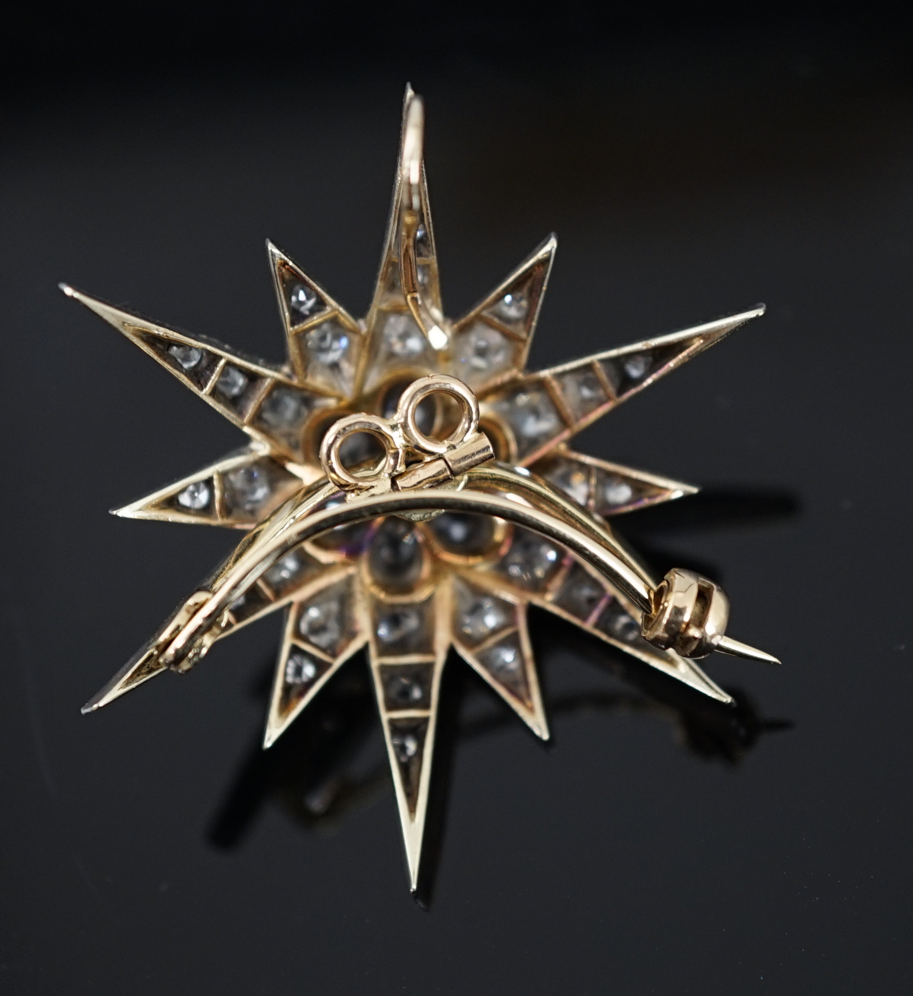 A Victorian gold, silver and graduated diamond cluster starburst brooch